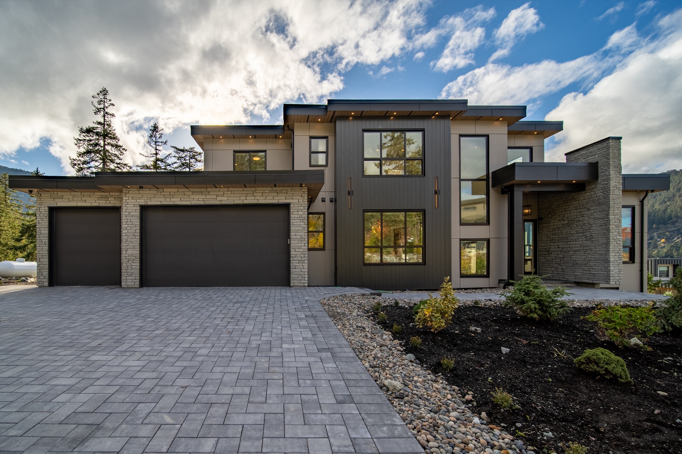 Modern Whistler home framed by forest and mountain scenery